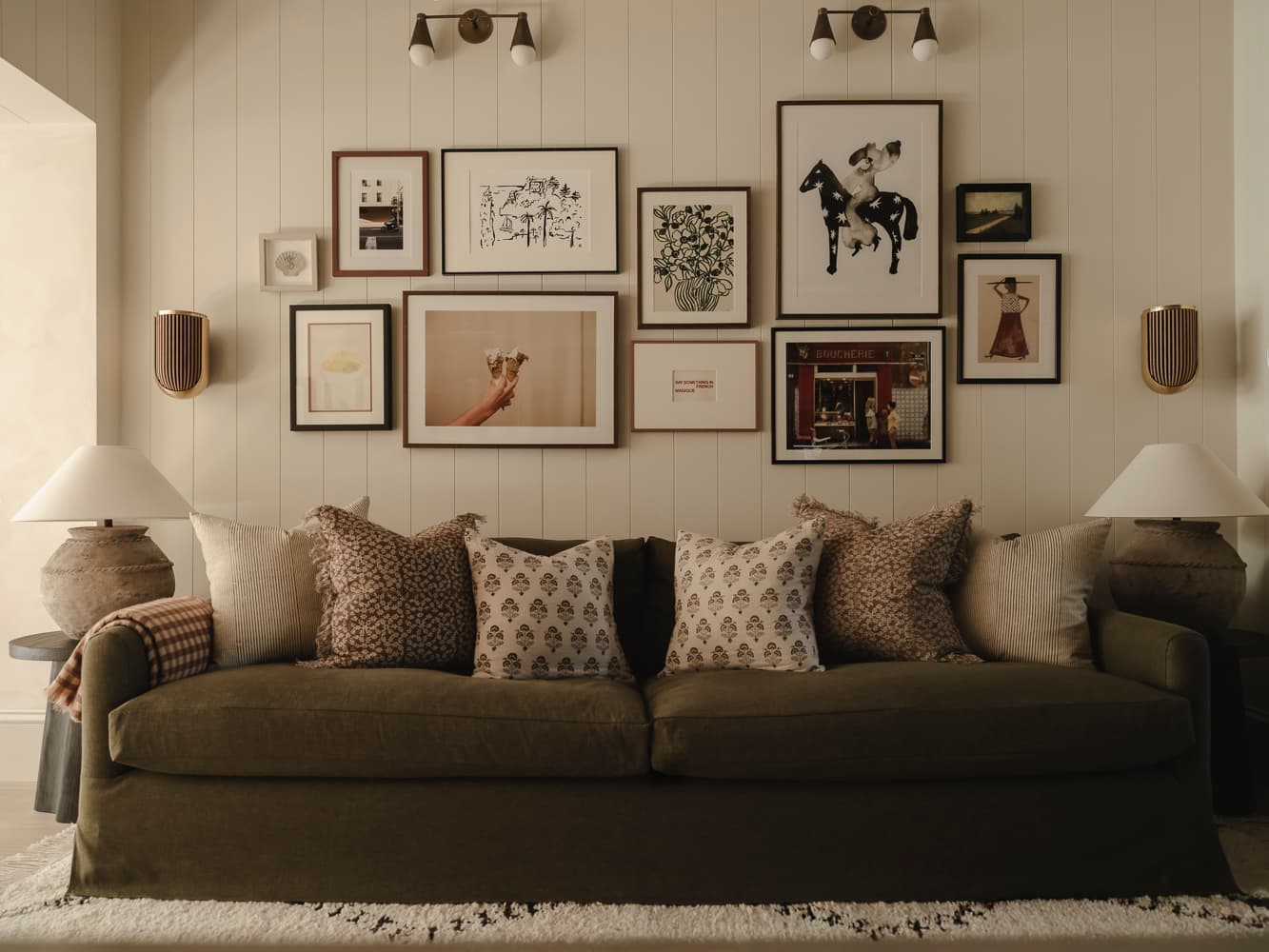 A full gallery wall of curated artwork
